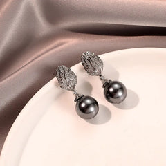 Angled view of the 14K Gold-Plated Zircon Leaf Gray Pearl Earrings
