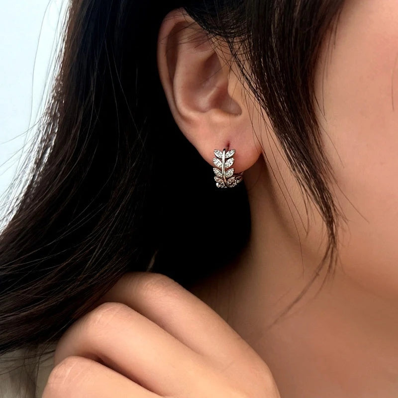 Close-up detail of the sparkling zircons and plating on the Silver Leaf Hoops