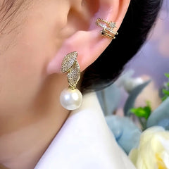 Close-up detail of the sparkling zircons and plating on the Pave Leaf Pearl