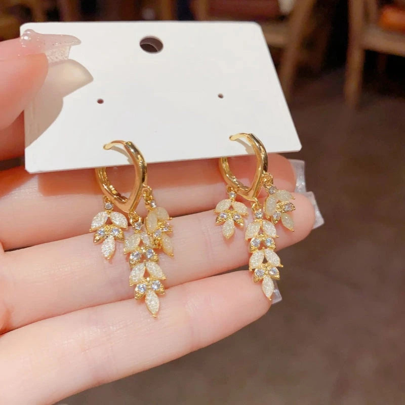 Close-up detail of the sparkling zircons and plating on the Golden Leaf Tassel