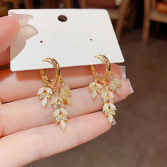 Close-up detail of the sparkling zircons and plating on the Golden Leaf Tassel