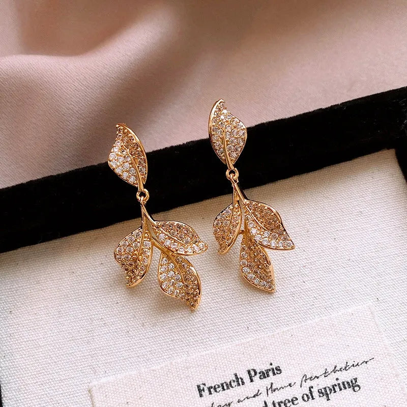 Close-up detail of the sparkling zircons and plating on the Fan Leaf Tassel