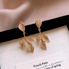 Close-up detail of the sparkling zircons and plating on the Fan Leaf Tassel