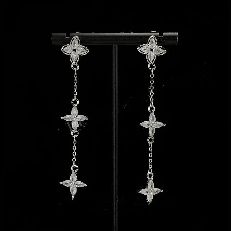 Angled view of the 14K Gold-Plated Zircon Leaf Tassel Earrings