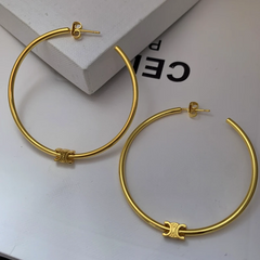 Angled view of the 14K Gold-Plated Letter C-Shaped Hoop Earrings