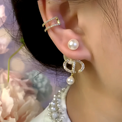 Model showcasing the dangle and style of the 14K Gold-Plated Zircon Letter CD Bead Jacket Earrings