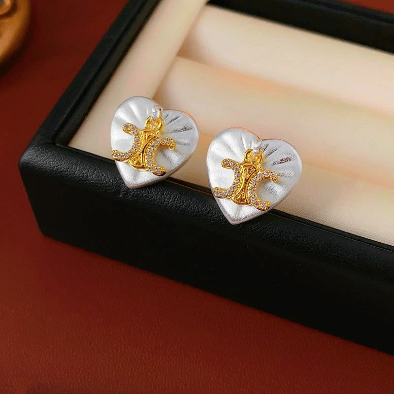 Angled view of the 14K Gold-Plated Zircon Letter Heart Stud Earrings