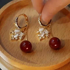 Close-up detail of the sparkling zircons and plating on the Red Maple Leaf Pearl
