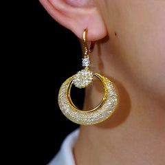 Model showcasing the dangle and style of the 14K Gold-Plated Zircon Mesh Crystal Hoop Earrings