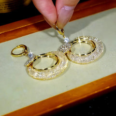 Angled view of the 14K Gold-Plated Zircon Mesh Crystal Hoop Earrings