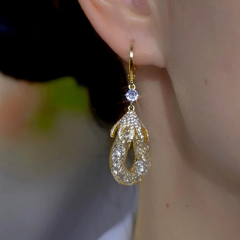 Model showcasing the dangle and style of the 14K Gold-Plated Zircon Mesh Water Drop Earrings