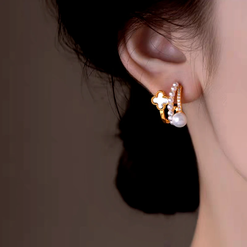 Close-up detail of the sparkling zircons and plating on the Layered Clover Pearl