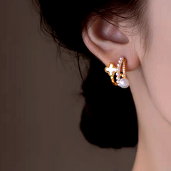 Close-up detail of the sparkling zircons and plating on the Layered Clover Pearl