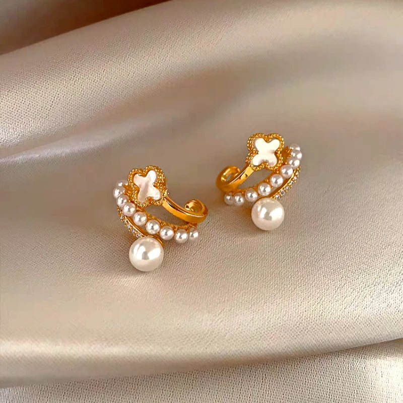 Angled view of the 14K Gold-Plated Zircon Multi-Layer Four-Leaf Flower Pearl Earrings