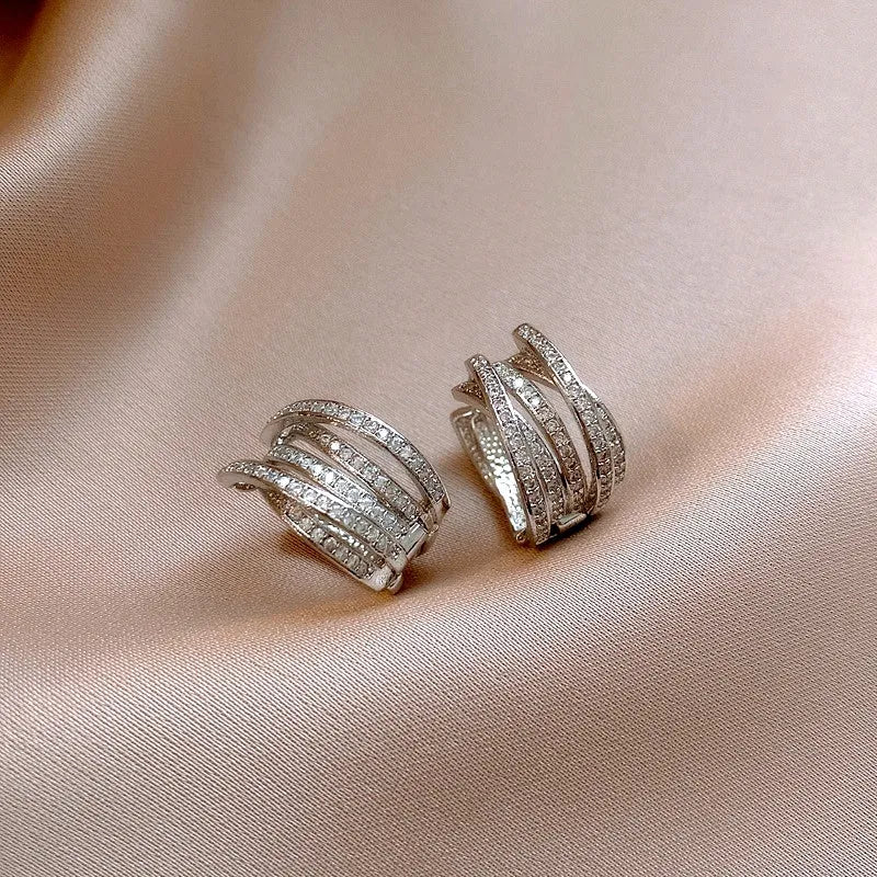 Close-up detail of the sparkling zircons and plating on the Triple Layer Hoops