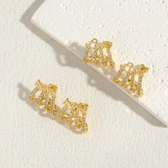 Angled view of the 14K Gold-Plated Zircon Multi-Layer LOVE And MAMA Letter Stud Earrings