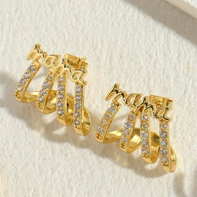 Model showcasing the dangle and style of the 14K Gold-Plated Zircon Multi-Layer LOVE And MAMA Letter Stud Earrings