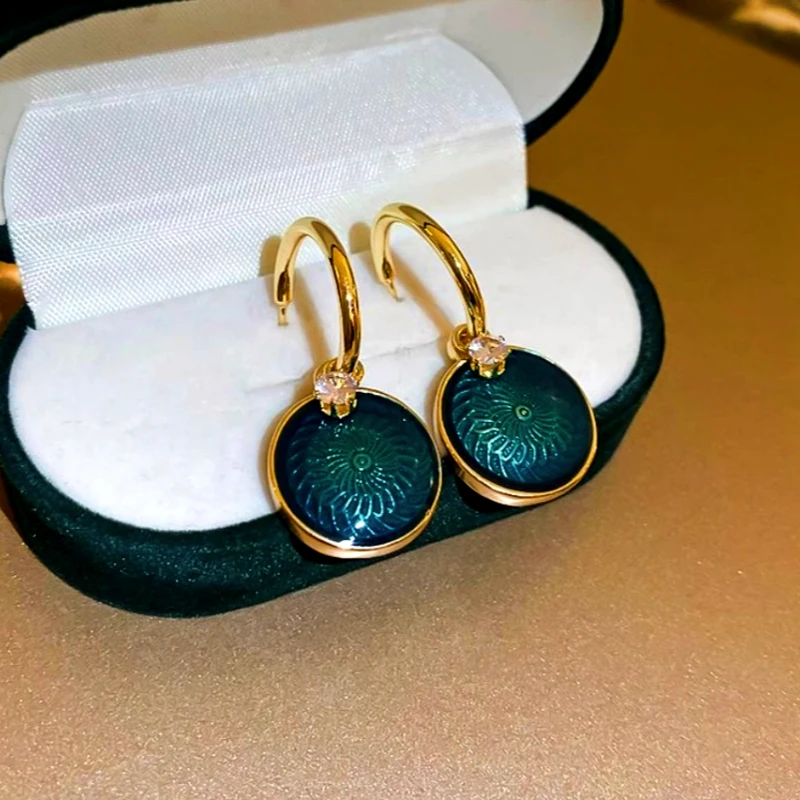 Angled view of the 14K Gold-Plated Zircon Oil Drop Earrings