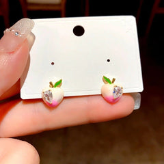 Close-up detail of the sparkling zircons and plating on the Pink Peach Studs