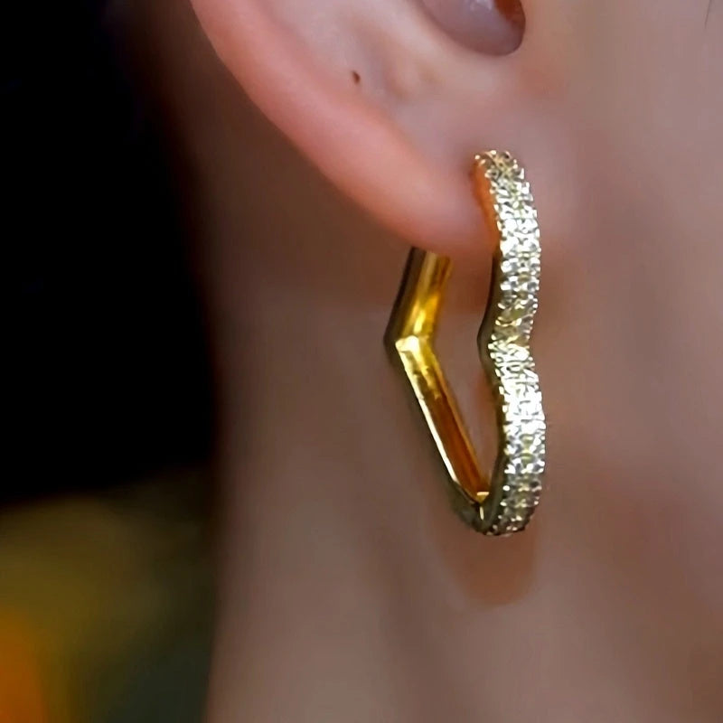 Close-up detail of the sparkling zircons and plating on the Peach Heart Drops