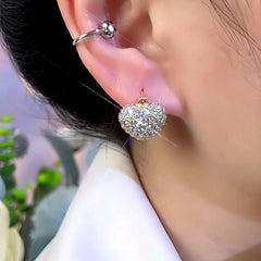 Model showcasing the dangle and style of the 14K Gold-Plated Zircon Pearl Double-Sided Heart Earrings