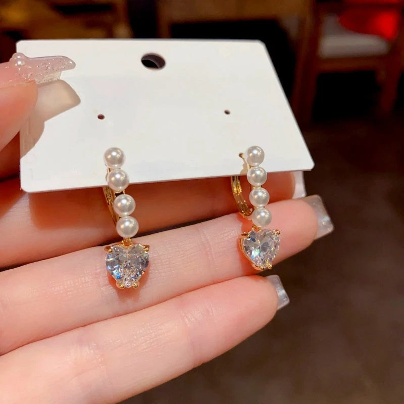 Close-up detail of the sparkling zircons and plating on the Dainty Pearl Hoops