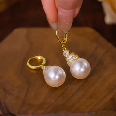 Close-up detail of the sparkling zircons and plating on the Twisted Hoop Pearl