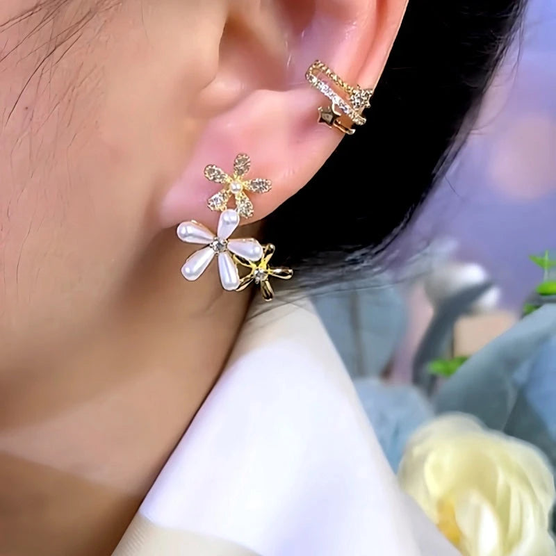 Model showcasing the dangle and style of the 14K Gold-Plated Zircon Pearl Flower Earrings