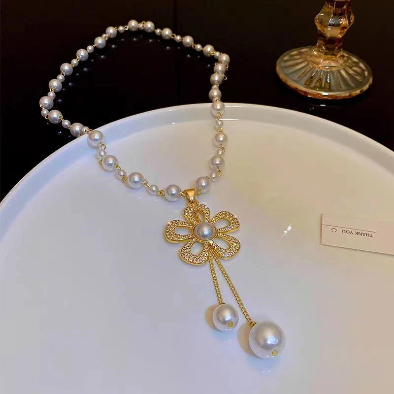Detailed view of the 14K Gold-Plated Zircon Pearl Flower Necklace chain and pendant