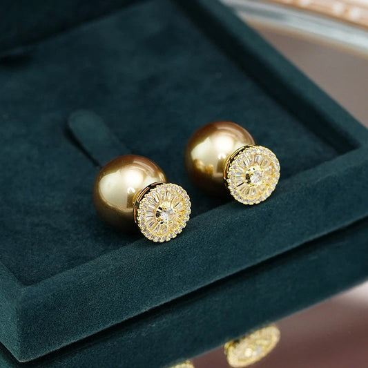 Model showcasing the dangle and style of the 14K Gold-Plated Zircon Pearl Jacket Earrings