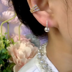 Model showcasing the dangle and style of the 14K Gold-Plated Zircon Pearl Little Hoop Earrings
