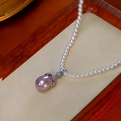 Detailed view of the 14K Gold-Plated Zircon Pearl Necklaces chain and pendant