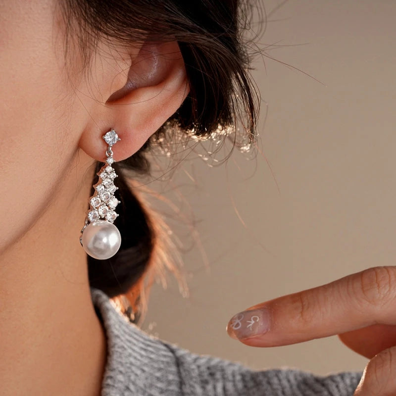 Close-up detail of the sparkling zircons and plating on the Pearl Tassel Earrings