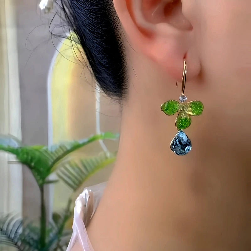 Model showcasing the dangle and style of the 14K Gold-Plated Zircon Petal Flower Ear Hooks