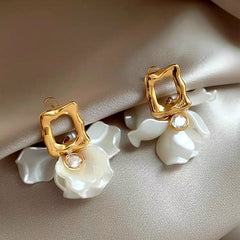 Model showcasing the dangle and style of the 14K Gold-Plated Zircon Petal Flower Earrings