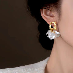 Close-up detail of the sparkling zircons and plating on the Flower Earrings