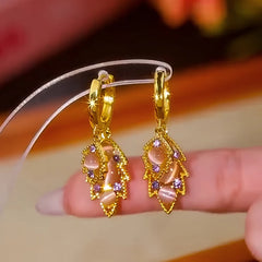 Pair of Gold Leaf Drop Earrings with Pink Opal & Purple Crystals on Display Stand