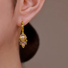 Gold Leaf Opal Drop Hoop Earring with Purple Crystals Worn on Woman's Ear