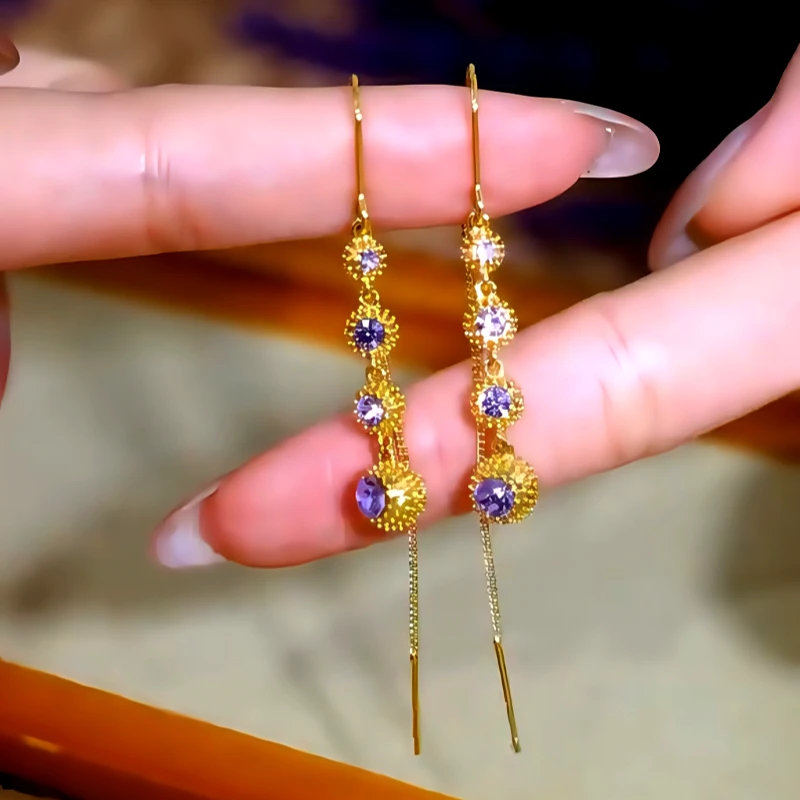 Close-up detail of the sparkling zircons and plating on the Threader Tassel Earrings
