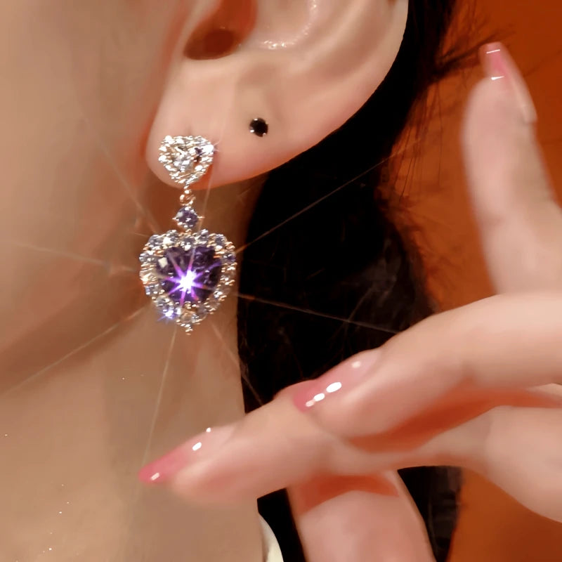 Close-up detail of the sparkling zircons and plating on the Purple Heart Earrings