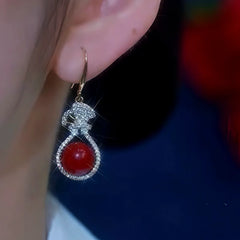 Close-up detail of the sparkling zircons and plating on the Ear Hook Earrings