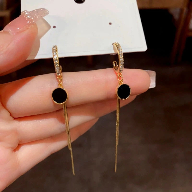 Close-up detail of the sparkling zircons and plating on the Tassel Earrings