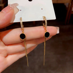 Close-up detail of the sparkling zircons and plating on the Tassel Earrings