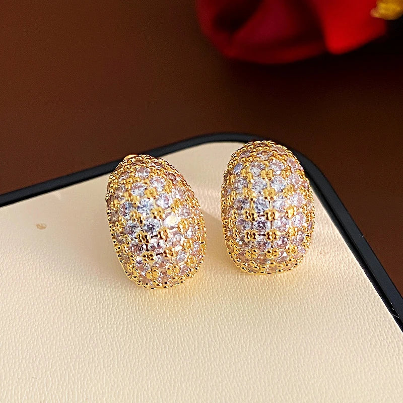 Angled view of the 14K Gold-Plated Zircon Small C-Shaped Earrings