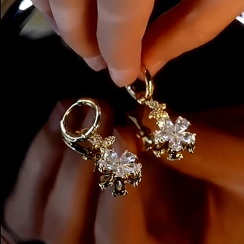 Angled view of the 14K Gold-Plated Zircon Small Flower Earrings