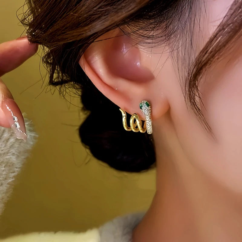 Close-up detail of the sparkling zircons and plating on the Snake Stud Earrings