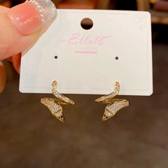 Close-up detail of the sparkling zircons and plating on the Snake-Shaped Earrings