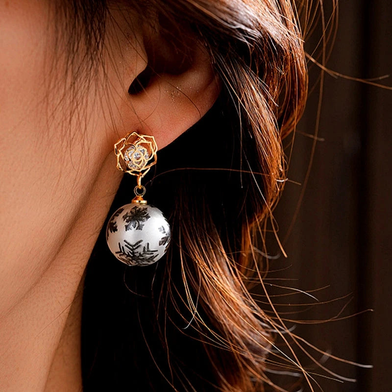 Close-up detail of the sparkling zircons and plating on the Snowflake Earrings