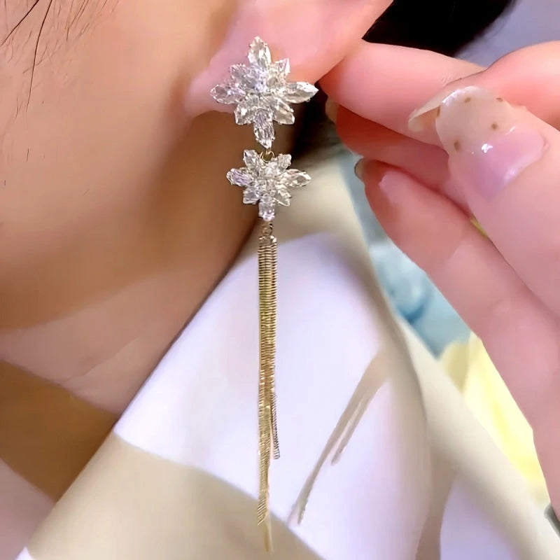 Close-up detail of the sparkling zircons and plating on the Tassel Earrings