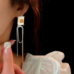 Close-up detail of the sparkling zircons and plating on the Tassel Earrings